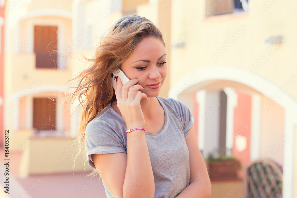 Talking. young pretty serious business woman grey shirt holding cellphone Talking. young pretty serious business woman grey shirt holding cellphone