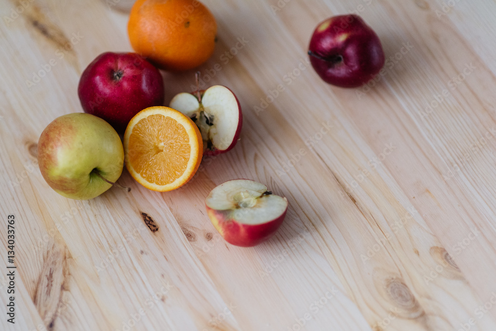 Fresh red and green apple, orange on wooden decks. Fresh red and green apple, orange on wooden decks.