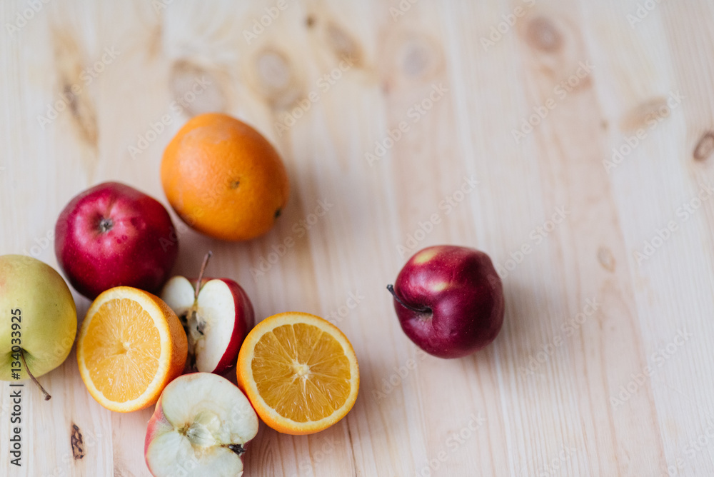 Fresh red and green apple, orange on wooden decks. Fresh red and green apple, orange on wooden decks.