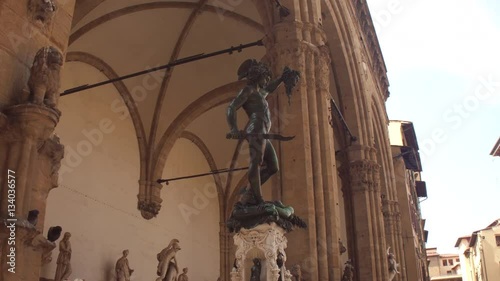 Bronze sculpture of Perseus with the Head of Medusa at the Piazza della Signoria, Florence, Italy, made by Benvenuto Cellini photo