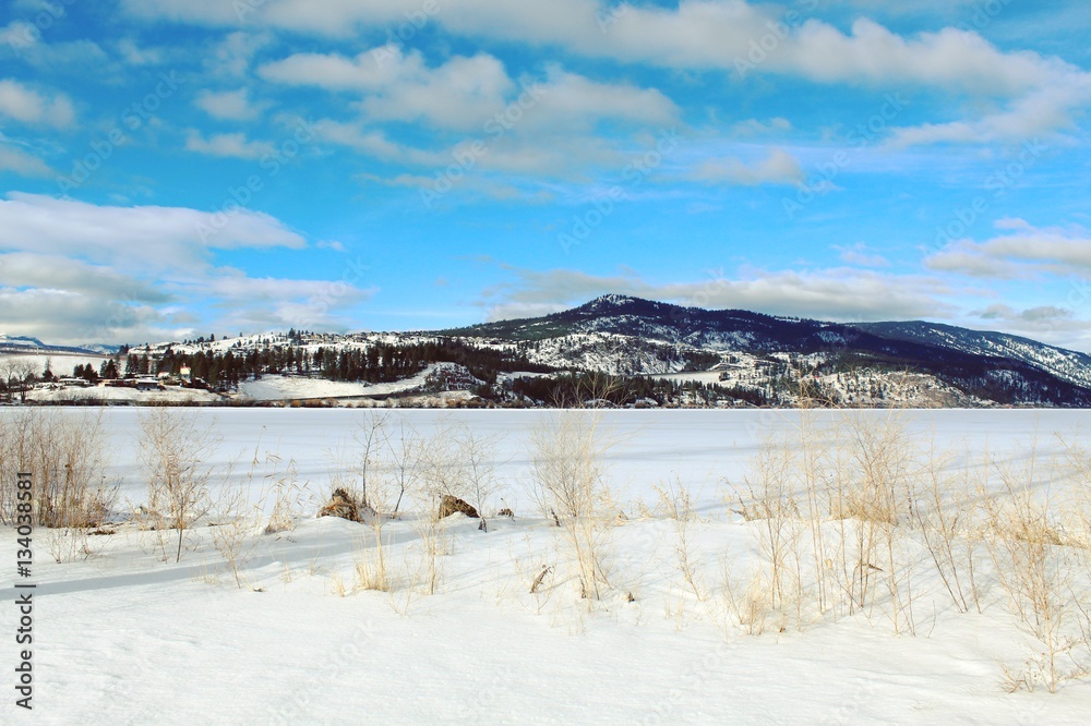 Scenic winter lake and mountains landscape Scenic winter lake and mountains landscape