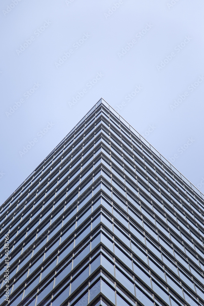 Modern glass facade of an office building in Tokyo Modern glass facade of an office building in Tokyo
