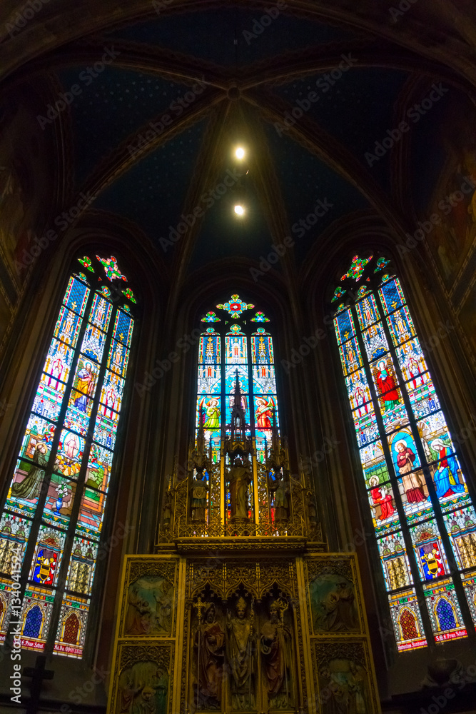 Altar and stained glass in St Vitus Cathedral in Prague