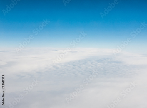 Aerial view of a sea of clouds and blue sky