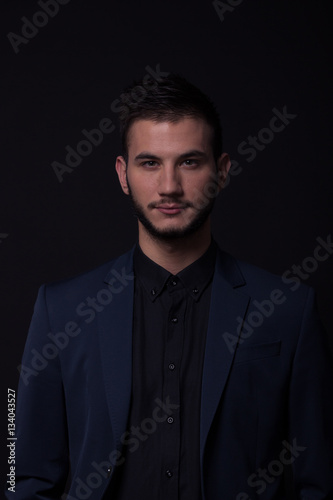 elegant suit dark, low light young man