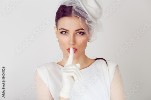 Bride shh Woman wide eyed asking for silence secrecy