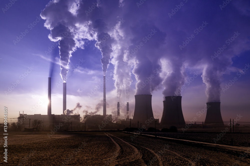 coal fired power station silhouette at sunset, Pocerady, Czech republic coal fired power station silhouette at sunset, Pocerady, Czech republic