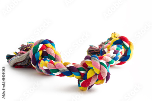 colorful cotton dog toy on a white background