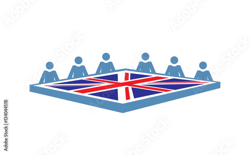 A conference table with people and the British flag photo