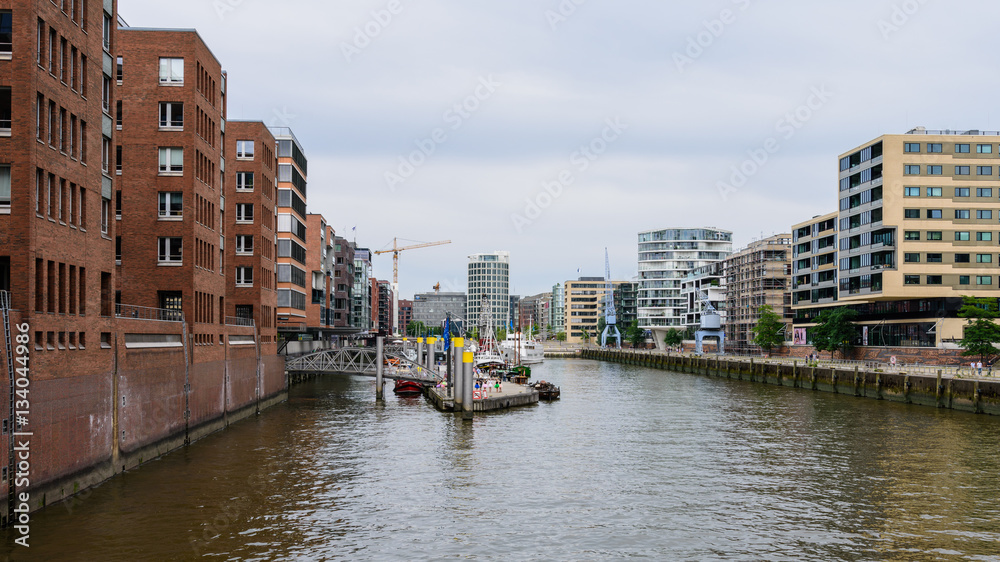 View of the Sandtorhafen in the Hafencity Hamburg on a cloudy day