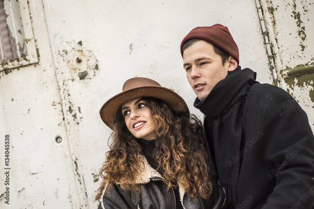 Romantic couple outside. Portrait of a young man and a young woman in love Romantic couple outside. Portrait of a young man and a young woman in love
