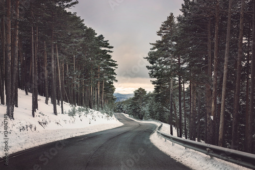 The journey through the snowy road. Feelings of traveling.