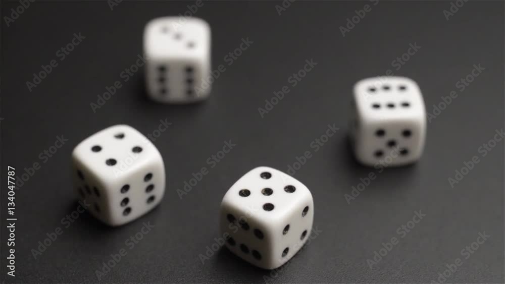 Four dice rolling on black background
Four dice rolling on black background