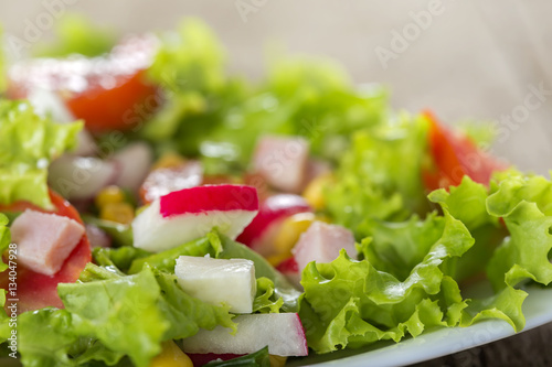 Fresh salad made with cheese, vegetable and ham