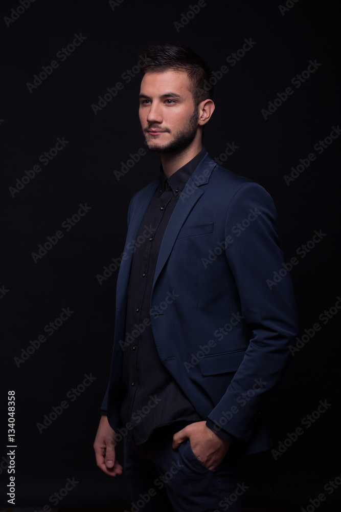 Fototapeta premium young man sexy looking sideways suit jacket elegant