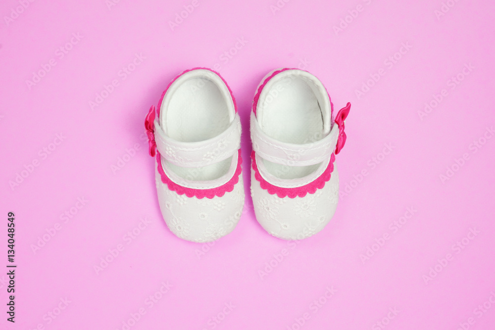 Children's shoes pink background. Children's shoes pink background.