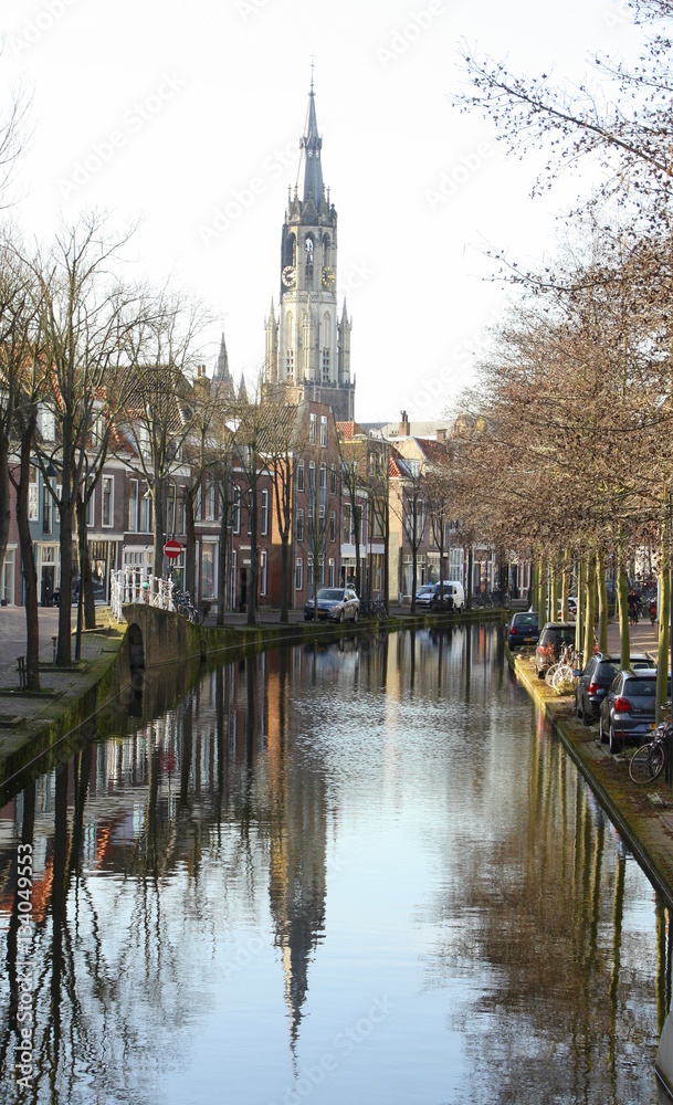 Canal and the tower of New Church in the city of Delft.The Netherlands
