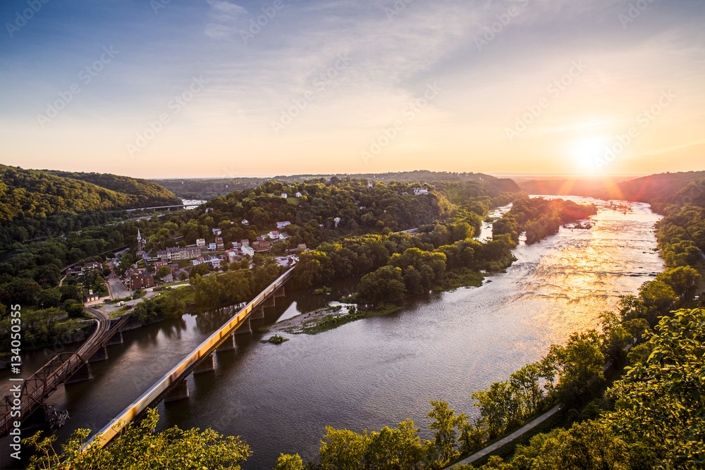 The sun sets over the Potomac River and Harpers Ferry, West Virginia.