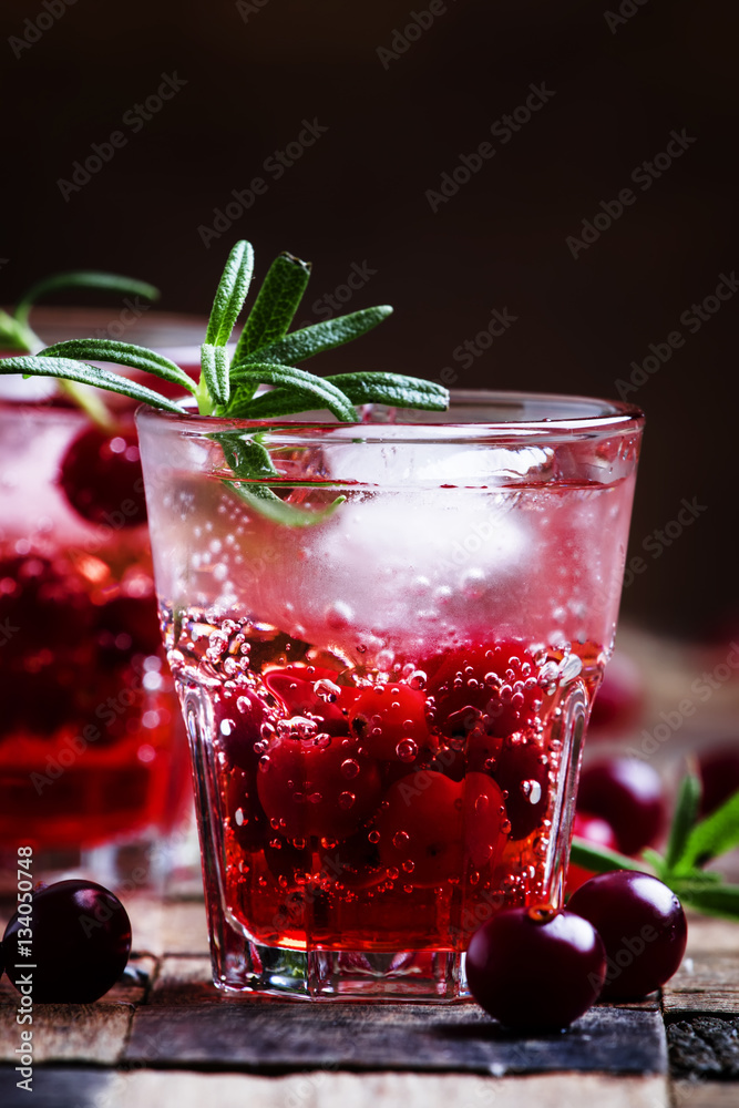 Two-layer cocktail with cranberry vodka, rosemary, soda and ice, Two-layer cocktail with cranberry vodka, rosemary, soda and ice,