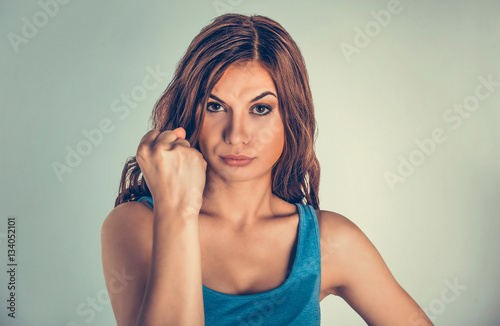 Closeup portrait angry woman with fists