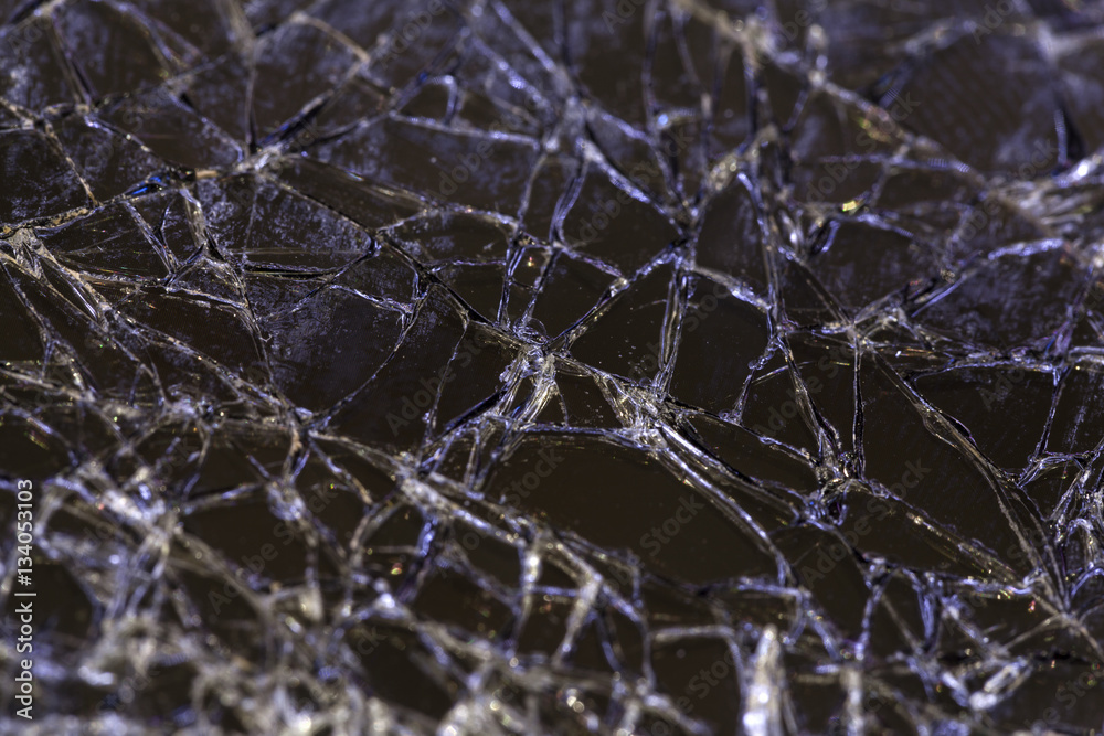 Close up image of a shattered smartphone screen Close up image of a shattered smartphone screen