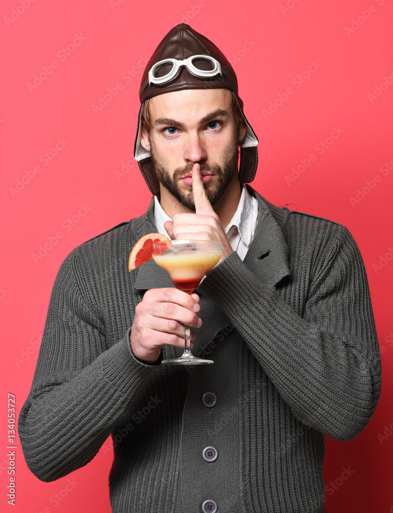 Fototapeta premium bearded pilot with cocktail in glass