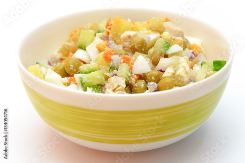 Russian dish called winter salad. Healty food in a bowl isolated