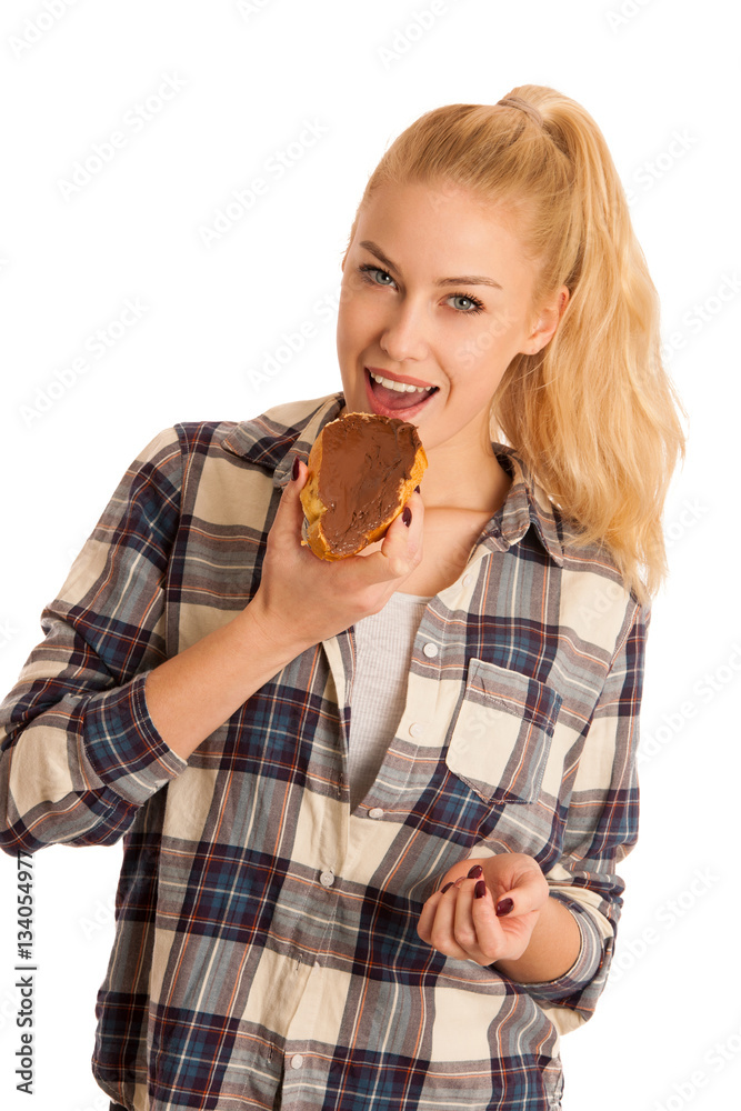 Young blond woman eating breakfast bread and nougat spread isola