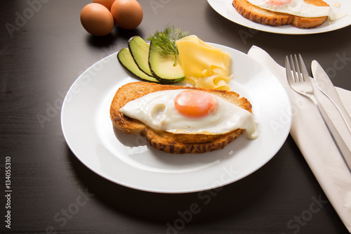 Fried egg with knife and fork