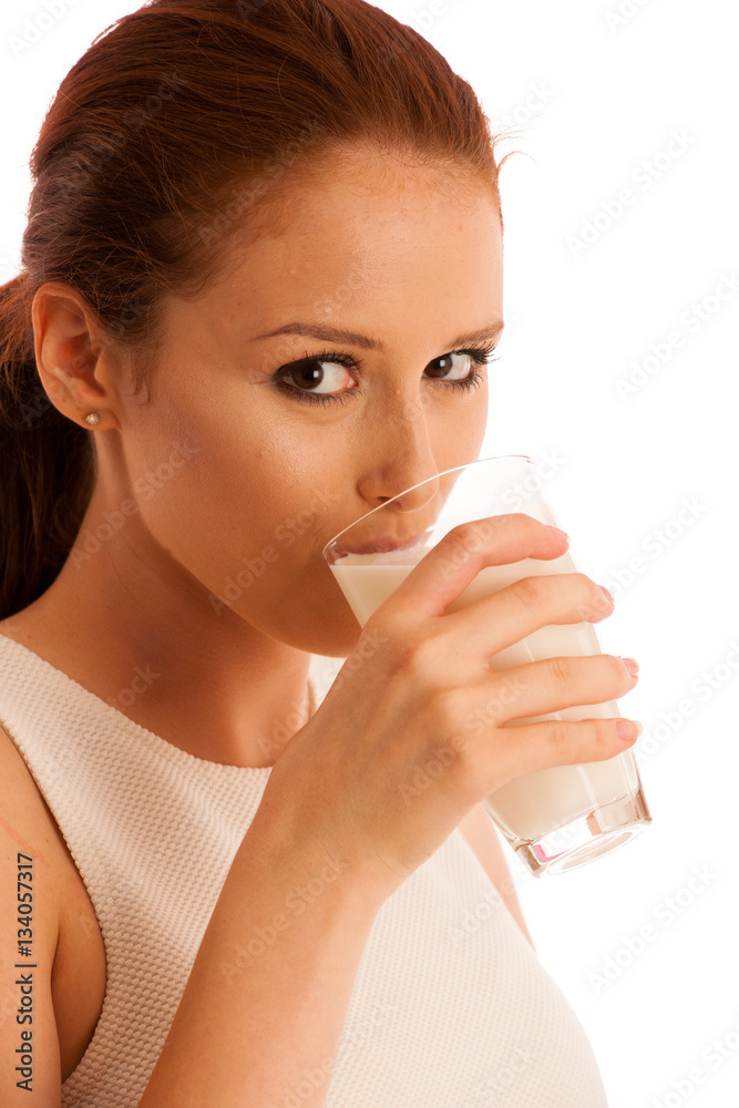 Woman drinking milk in the morning isolated over white backgroun Woman drinking milk in the morning isolated over white backgroun