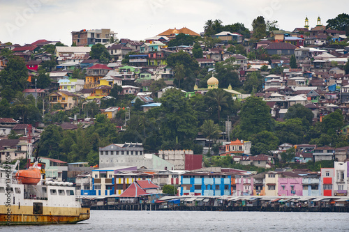 Ambon City, Indonesia. Ambon City on Ambon Island boasts excellent transport connections and facilities and make it a gateway to Maluku, and its colonial forts, green hills and pleasant beaches. photo