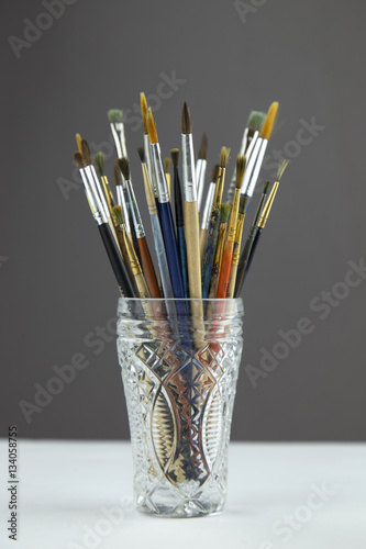 painting brushes in glass