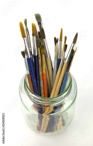 painting brushes in glass