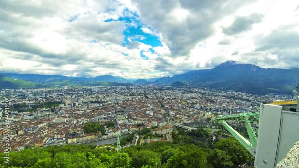 Picturesque aerial view of Grenoble city, France. Grenoble-Bastille cable car on the foreground. Time Lapse. 4K UltraHD