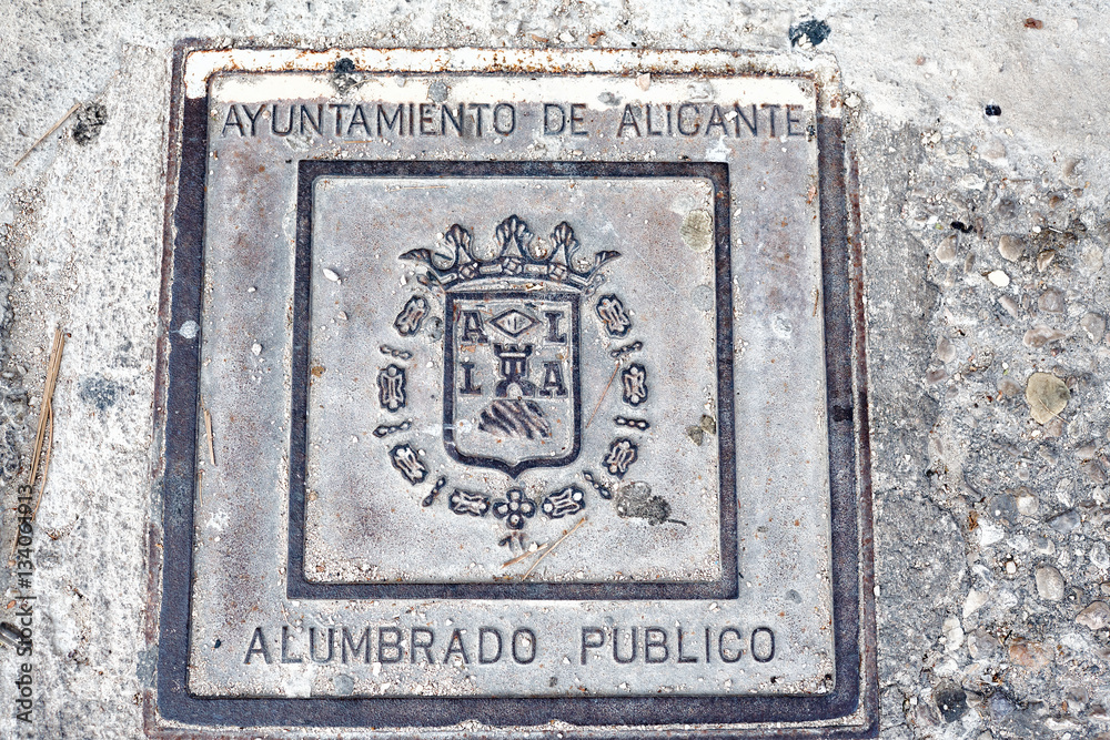 City electric manhole cover, decorative metal hatch for electrical networks. Alicante, Spain