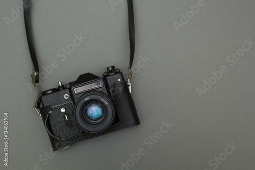 Retro photo camera on a strap