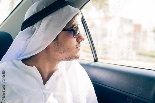 Young Arabian Man Sitting In The Car