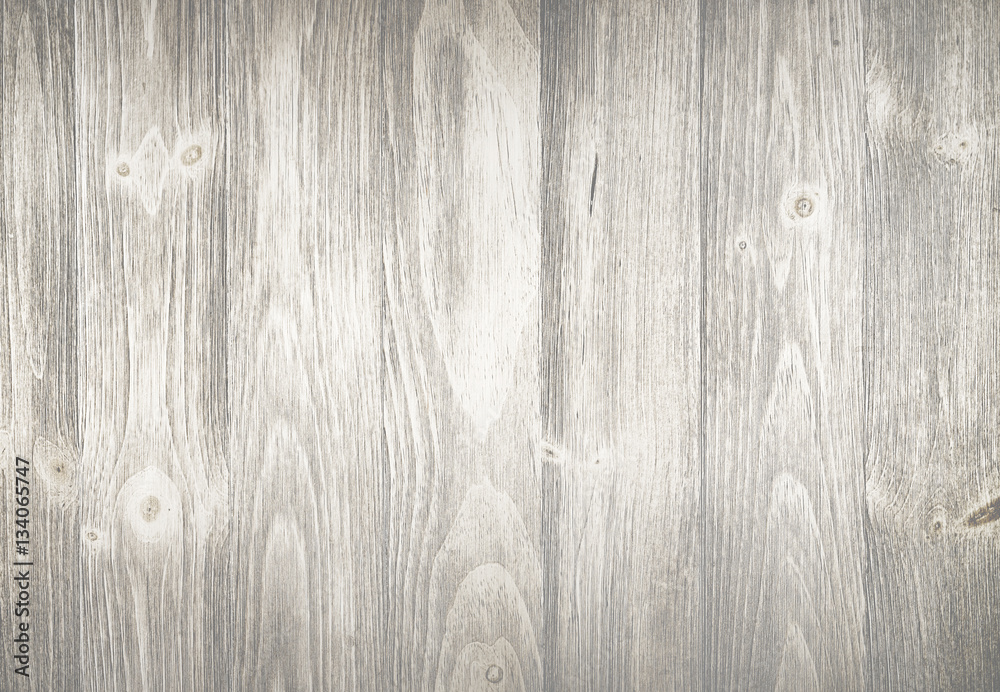 Obraz premium Old weathered wood surface with long boards lined up. Wooden planks on a wall with grain and texture. Light neutral tones with age.