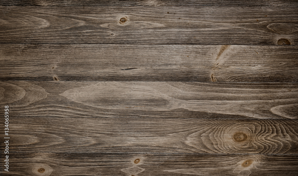 Old weathered wood surface with long boards lined up. Wooden planks on a wall or floor with grain and texture. Dark neutral tones with contrast. - obrazy, fototapety, plakaty 