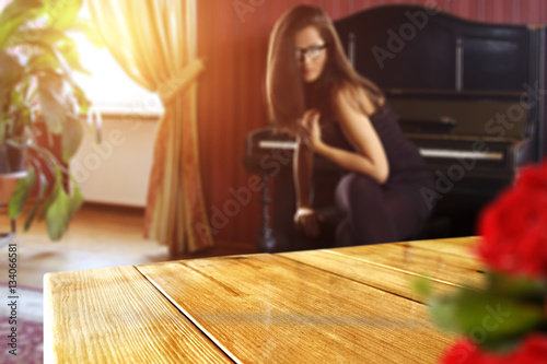 wooden table of free space and woman in black dress 