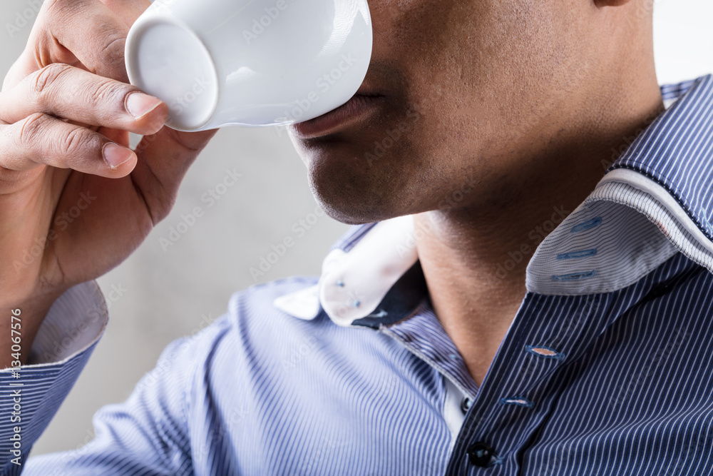 unrecognizable man drinking a coffee (close up) unrecognizable man drinking a coffee (close up)
