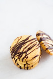 Stack of butter cookies with chocolate on a white background