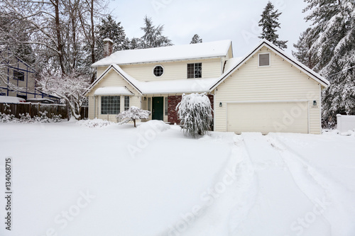 Wallpaper Mural Residential home.  Average american two story residential home covered with snow during winter storm. Torontodigital.ca