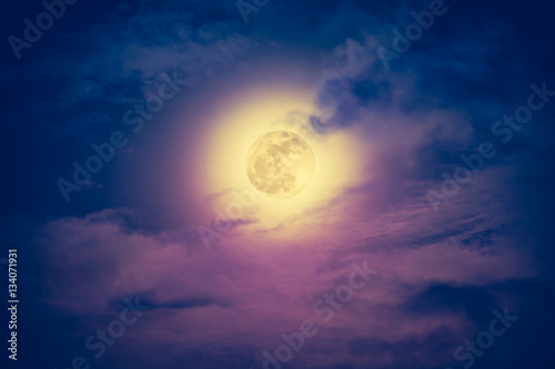 Nighttime sky with cloudy and beautiful moon. Vintage effect tone