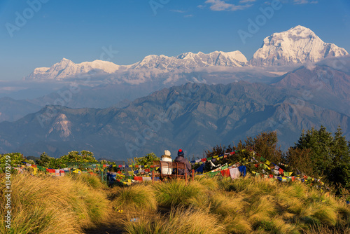 Couple watching the Mt. Dhaulagiri (8,172m) from Poonhill, Nepal. photo
