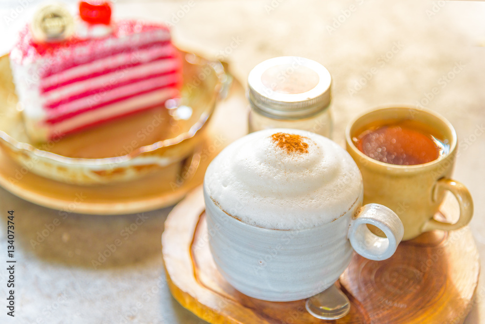 A cup of coffee and a piece of cake. A cup of coffee and a piece of cake.