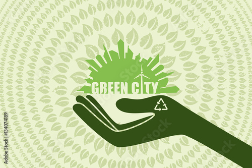 Save environment and green power concept. Hand holding the graphic of city with text inside and green leaf flow around.