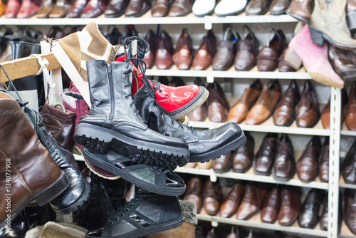 Shop of second hand leather shoes. Many used shoes for sale.