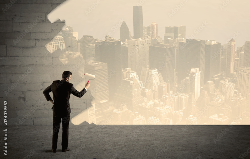 Salesman painting city scape on wall Salesman painting city scape on wall