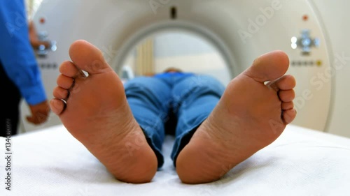 A patient is loaded into an mri machine